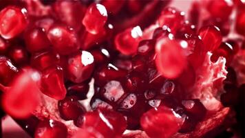 Pomegranate seeds fall on a piece. Filmed on a high-speed camera at 1000 fps. High quality FullHD footage video