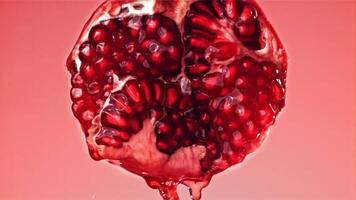 Fresh juice runs down the pomegranate. Filmed on a high-speed camera at 1000 fps. High quality FullHD footage video