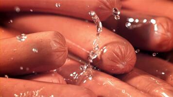 Drops of water drip onto fresh sausages. Filmed on a high-speed camera at 1000 fps. High quality FullHD footage video