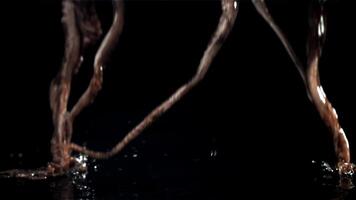 A fresh octopus falls on the table. On a black background. Filmed on a high-speed camera at 1000 fps. High quality FullHD footage video