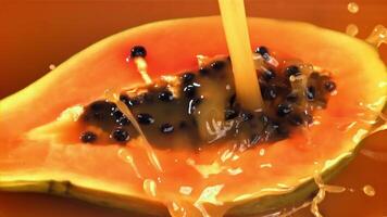 Fresh papaya with a splash of juice. Filmed on a high-speed camera at 1000 fps. High quality FullHD footage video