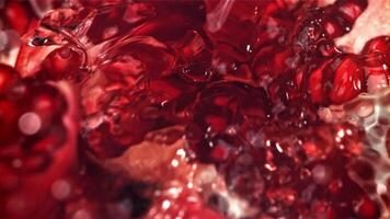 Fresh juice runs down the pomegranate. Filmed on a high-speed camera at 1000 fps. High quality FullHD footage video