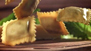 Italian ravioli falls on the table. Filmed on a high-speed camera at 1000 fps. High quality FullHD footage video