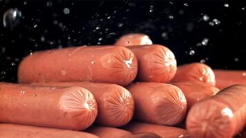 Drops of water drip onto fresh sausages. Filmed on a high-speed camera at 1000 fps. High quality FullHD footage video