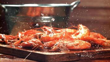 Drops of water drip onto fresh shrimp. Filmed on a high-speed camera at 1000 fps. High quality FullHD footage video