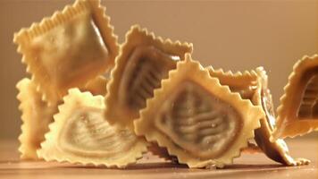Italian ravioli falls on the table. Filmed on a high-speed camera at 1000 fps. High quality FullHD footage video