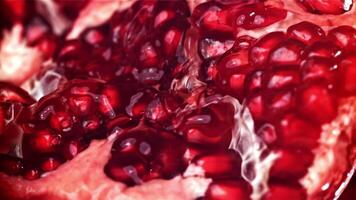 Fresh juice runs down the pomegranate. Filmed on a high-speed camera at 1000 fps. High quality FullHD footage video