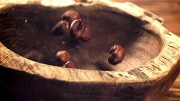 Hazelnuts fall into a wooden bowl. Filmed on a high-speed camera at 1000 fps. High quality FullHD footage video