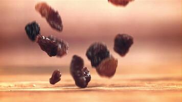 Raisins fall on the table. Filmed on a high-speed camera at 1000 fps. High quality FullHD footage video