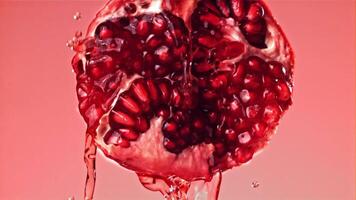 Fresh juice runs down the pomegranate. Filmed on a high-speed camera at 1000 fps. High quality FullHD footage video