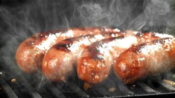 Sausages are fried with splashes in a pan. Filmed on a high-speed camera at 1000 fps. High quality FullHD footage video