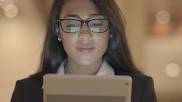 Confident Woman Browsing the Web Internet on Mobile Tablet Device video