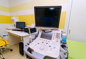 Ultrasound device for testing sonogram. Clinic interior. Sonography. Health tests concept. Closeup photo