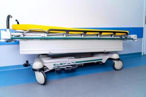 Emergency bed staying in hospital. Medical equipment for emergency service. photo