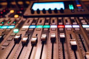 Sound mixer control panel. Professional audio mixing console. Close-up photo