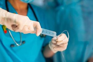 General anesthesia. Surgeons operating on patient in an operating theatre. photo