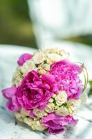 beautiful modern wedding bouquet on white blurred background. Closeup photo