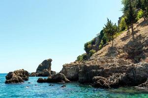 The mountains and sea scenery with blue sky, beautiful nature. Summer time. Vocation concept. Selective focus. photo