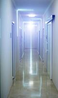 Long corridor in the hospital. Empty hospital space. Selective focus. photo