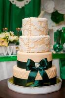 A traditional and decorative wedding cake at wedding reception photo