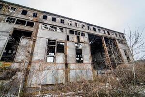 Abandoned industrial building. Ruins of an old factory photo