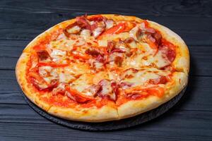 Delicious pizza on wooden table. Food delivery photo