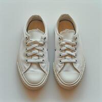 AI Generated White sneakers on white background photo