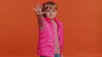 Girl kid say no hold palm folded crossed hands in stop gesture, warning of finish, prohibited access video