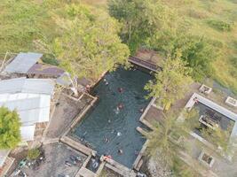 Aerial view of a pond of natural water springs in Klaten, Central Java, Indonesia photo