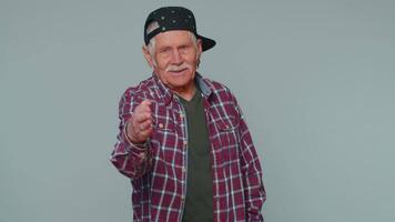 Friendly man outstretching hand to camera, offering handshake, greeting with kind smile, welcoming video