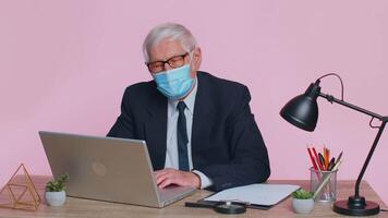 Senior businessman removing, taking off medical mask and throws it away, ending pandemic quarantine video