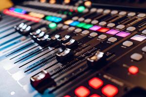 professional concert mixing console is equipped with high-precision and long-stroke faders. Close-up photo