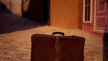 A suitcase sitting on the ground in front of a building video