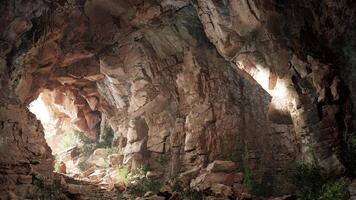 A cave filled with lots of rocks and water video