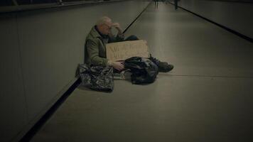 Elderly Homeless Man Suffering from Poverty Looking for Help at Train Station video