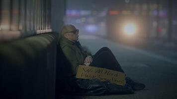 Kind Woman Helping Sad Elderly Homeless Man Outside In Cold Night video