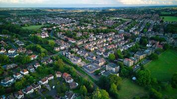 Aerial view of a suburban neighborhood at dusk with lush greenery and rows of houses in Harrogate, North Yorkshire. photo