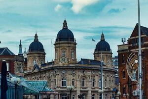 Elegant historical building with domed towers under a cloudy sky, urban European architecture. photo