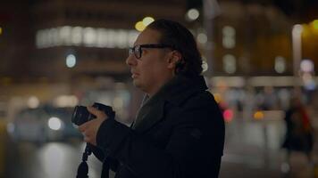 Street Photographer Capturing Pictures of People Traveling at Night video