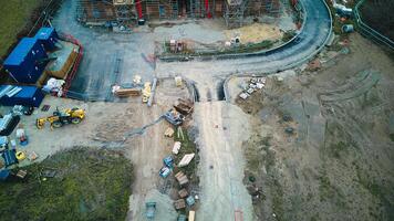 Aerial view of a construction site with heavy machinery and building materials. photo