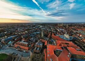 Aerial view of a European city at dusk with historic buildings and a dramatic sky in York, North Yorkshire photo