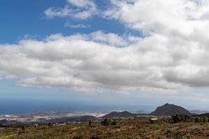 Scenic landscape with mountains under a cloudy sky in Tenerife. photo