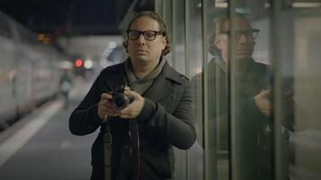 Street Photographer Capturing Pictures of People Traveling at Night video