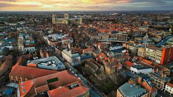 Aerial view of a European city at sunset with warm lighting, showcasing historic buildings and urban landscape in York, North Yorkshire photo