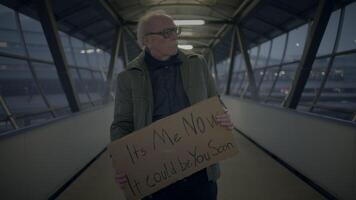 Elderly Homeless Man Suffering from Poverty Looking for Help at Train Station video