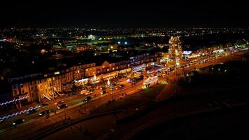 Aerial night view of a cityscape with illuminated streets and buildings in Backpool, England. photo