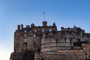 Historic castle silhouette against twilight sky, ancient architecture, travel background. photo