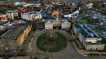 Aerial view of a historic circular stone fortress at dusk, with surrounding urban landscape and sunset sky in York, North Yorkshire photo