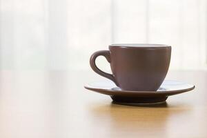 Coffee cup on wood table photo