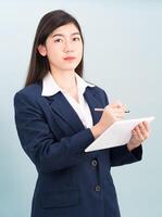 Teenage girl in suit using computer digital tablet photo